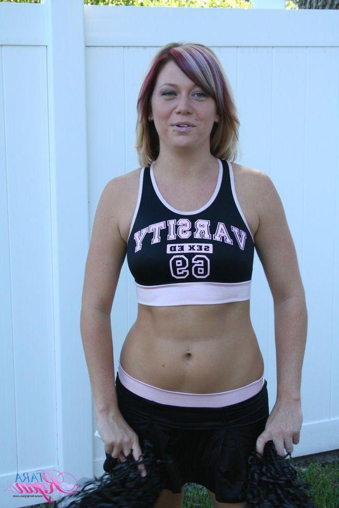 20P Pictures of teen porn girl Tara Ryan flashing her tits while cheering