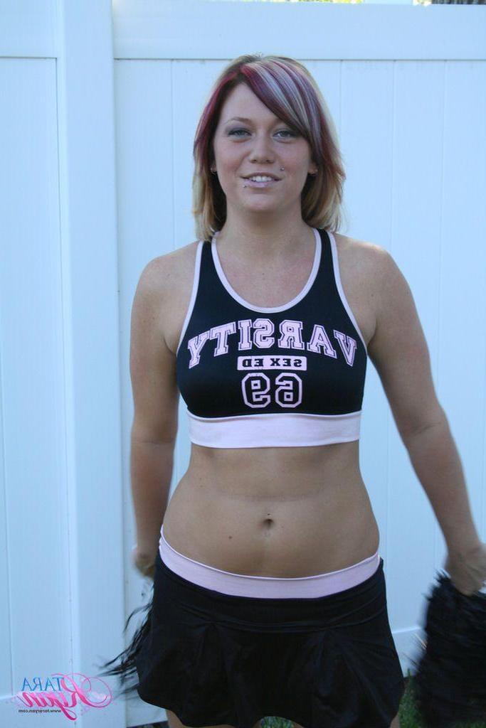 20P Pictures of teen porn girl Tara Ryan flashing her tits while cheering