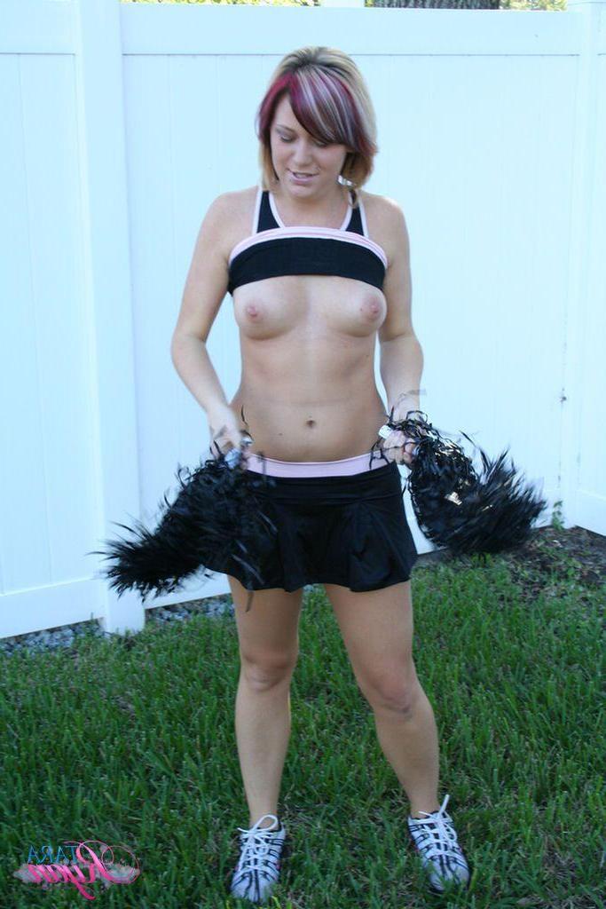 20P Pictures of teen porn girl Tara Ryan flashing her tits while cheering