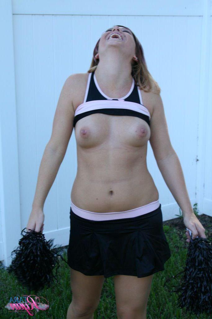 20P Pictures of teen porn girl Tara Ryan flashing her tits while cheering