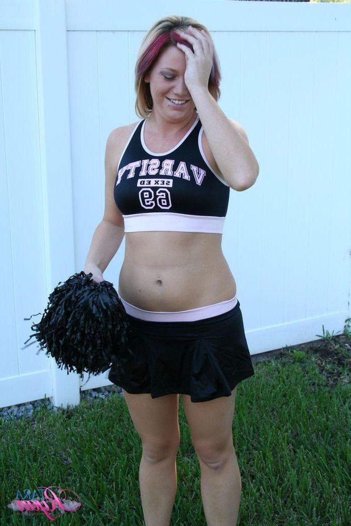20P Pictures of teen porn girl Tara Ryan flashing her tits while cheering