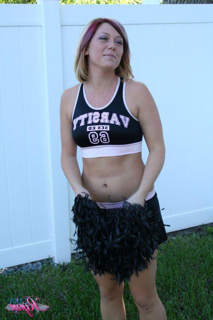 20P Pictures of teen porn girl Tara Ryan flashing her tits while cheering