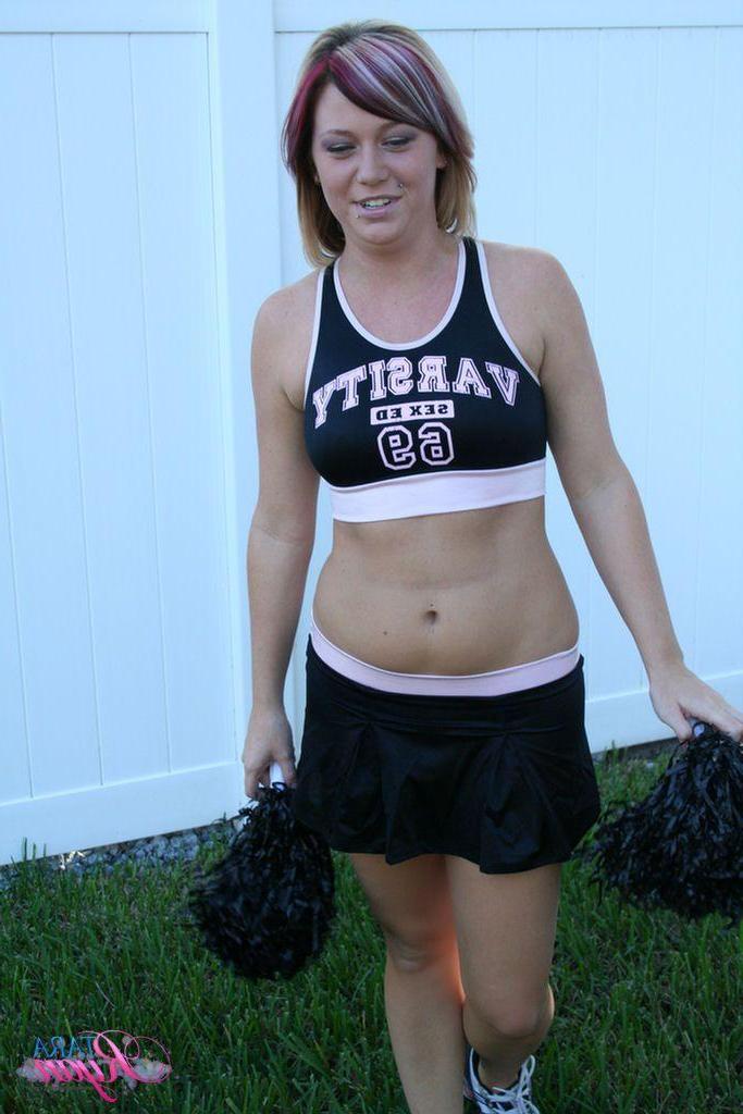 20P Pictures of teen porn girl Tara Ryan flashing her tits while cheering