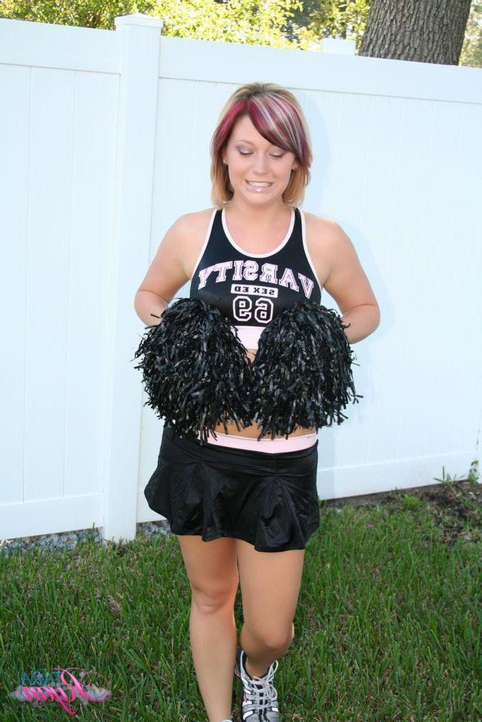 20P Pictures of teen porn girl Tara Ryan flashing her tits while cheering