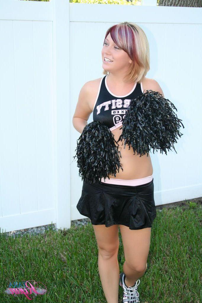 20P Pictures of teen porn girl Tara Ryan flashing her tits while cheering