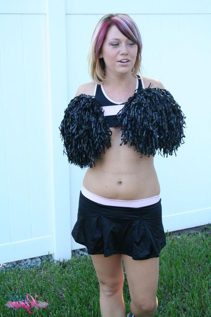 20P Pictures of teen porn girl Tara Ryan flashing her tits while cheering