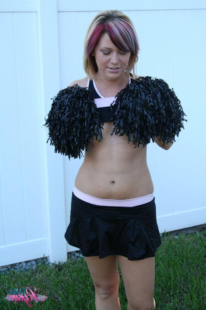 20P Pictures of teen porn girl Tara Ryan flashing her tits while cheering