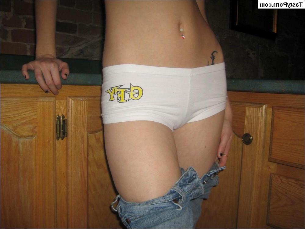16P Pictures of teen model Tasty Julie taking her shirt off