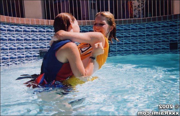 17P Pictures of two teen cheerleaders being naughty in the pool