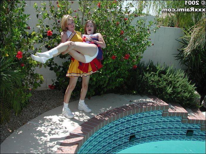 17P Pictures of two teen cheerleaders being naughty in the pool