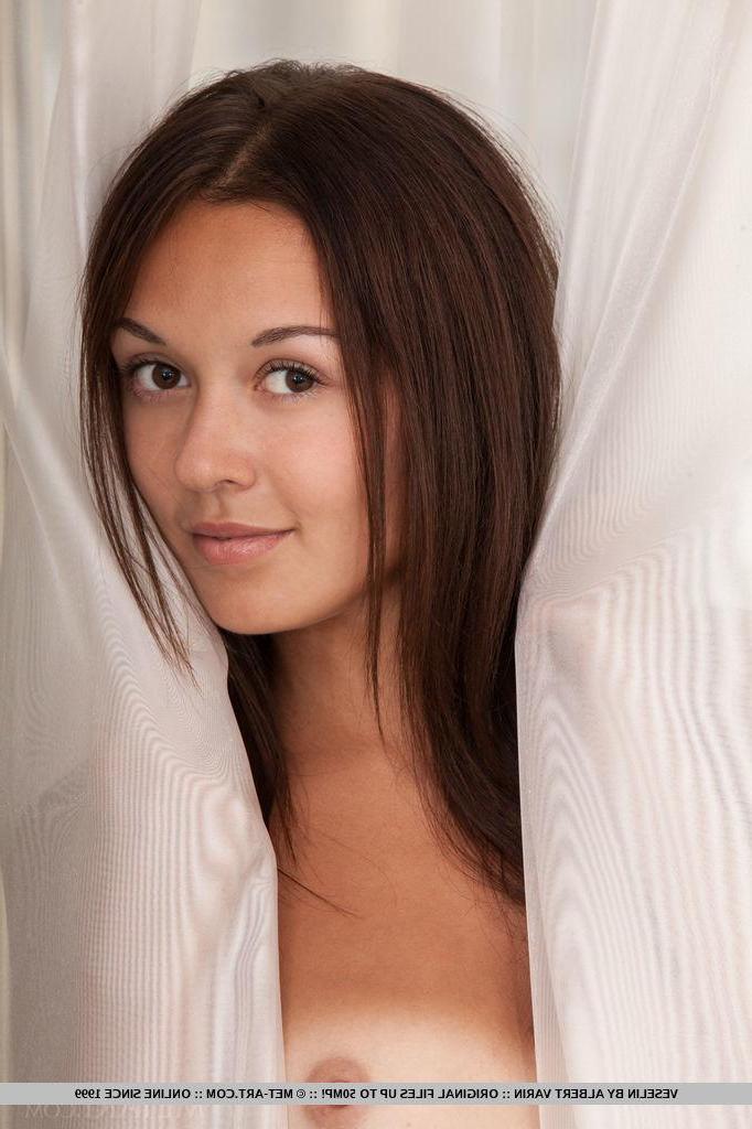 18P Brunette hottie Veselin strips nude in bed and shows off her tight pussy