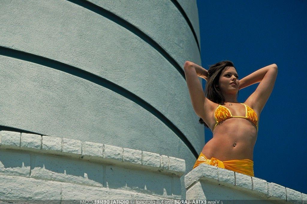 17P Pictures of a hot brunette slipping out of her bikini