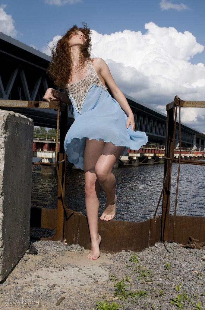 16P Pretty girl Talia A strips naked outside in "Presenting Talia A"