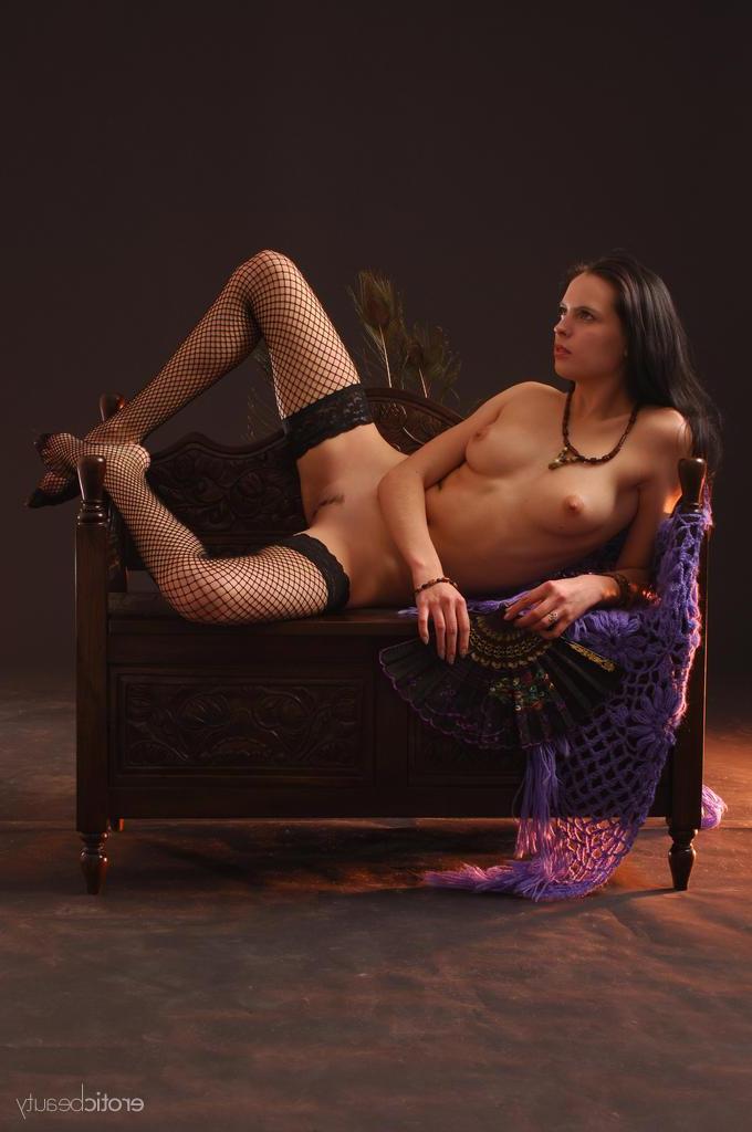 16P The dark-haired debutante Valya portrays an enchanting gypsy princess as she sits on a wooden chair