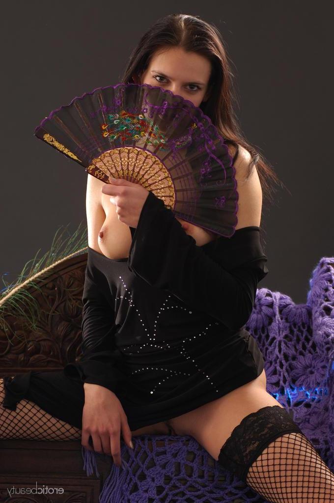 16P The dark-haired debutante Valya portrays an enchanting gypsy princess as she sits on a wooden chair