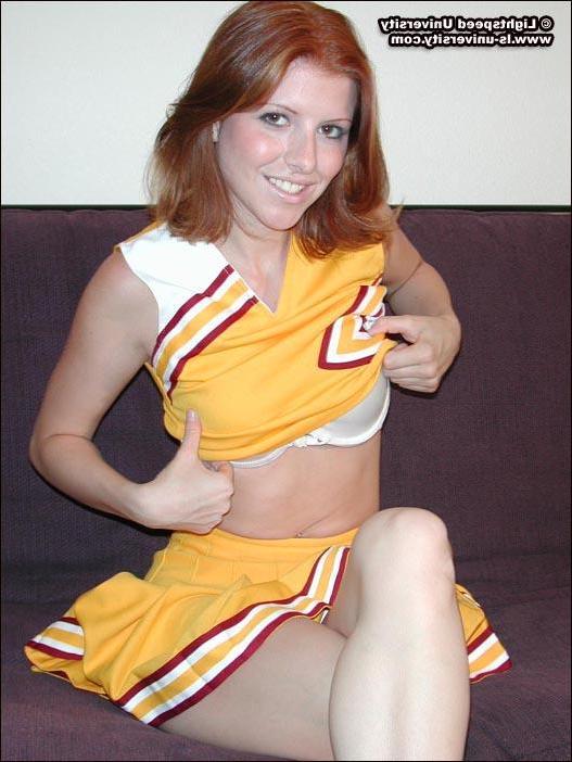 20P Pics of a hot redhead cheerleader getting naked for you