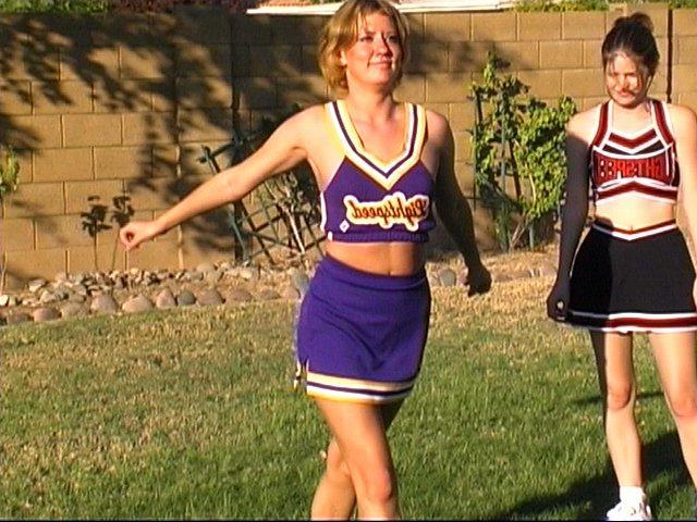 20P Pictures of cheerleaders doing their moves outside
