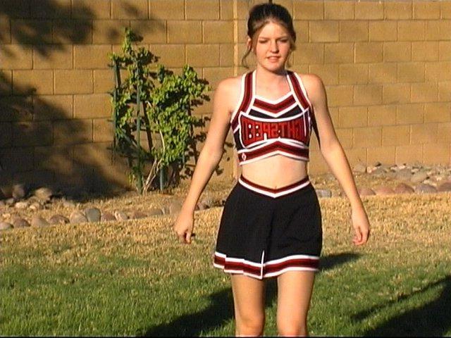 20P Pictures of cheerleaders doing their moves outside