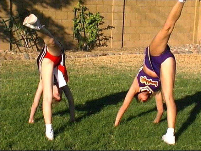 20P Pictures of cheerleaders doing their moves outside