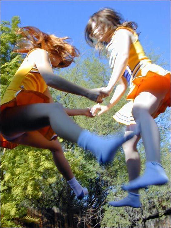 17P Pictures of two cheerleaders on a trampoline