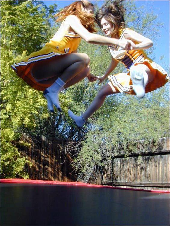 17P Pictures of two cheerleaders on a trampoline
