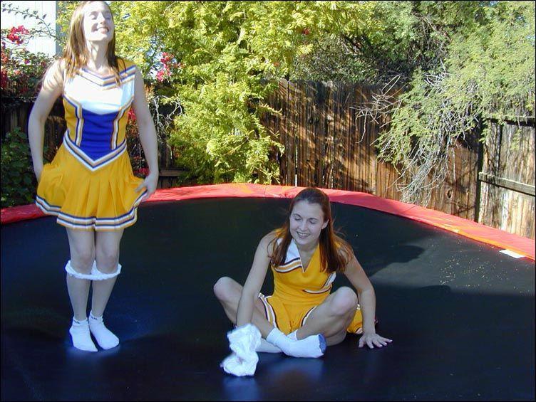 17P Pictures of two cheerleaders on a trampoline