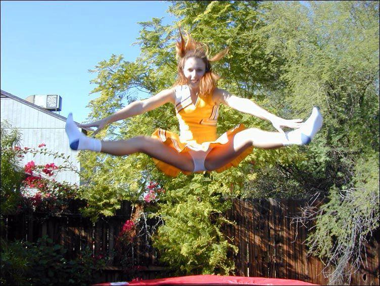 17P Pictures of two cheerleaders on a trampoline