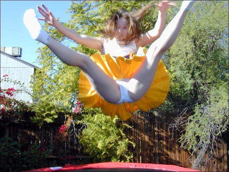 17P Pictures of two cheerleaders on a trampoline