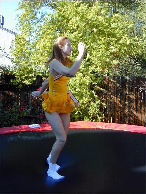 17P Pictures of two cheerleaders on a trampoline