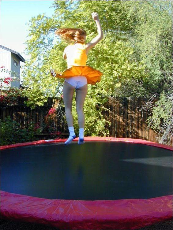17P Pictures of two cheerleaders on a trampoline