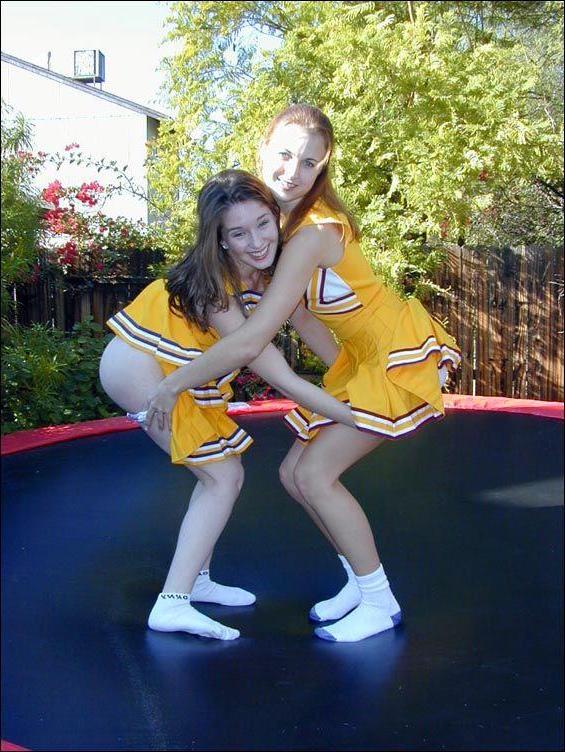 17P Pictures of two cheerleaders on a trampoline