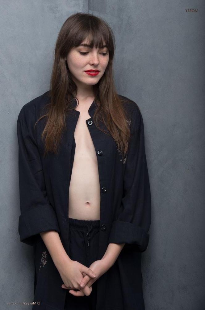 11P Art model Emmy exposes her perky breasts in the studio