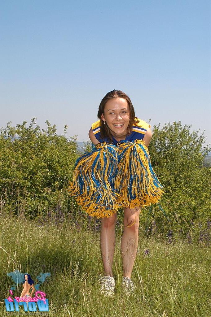 20P Cheerleader toys her pussy outside
