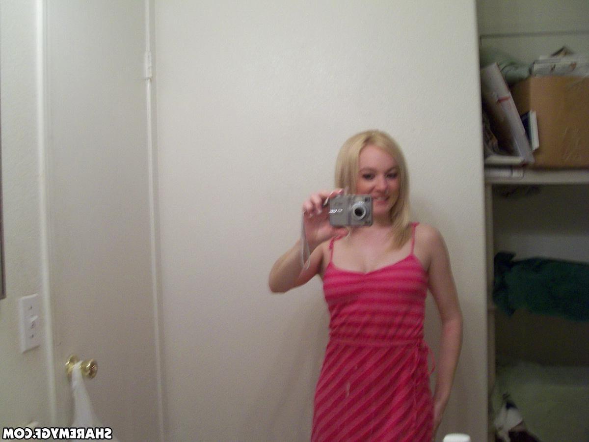 20P A stunning blonde teen GF takes pics of her sexy body in the mirror