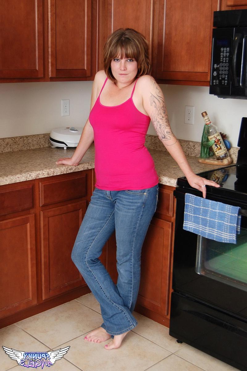 12P Curvy amateur Misty shows off her playful teasing side as she strips naked in the kitchen