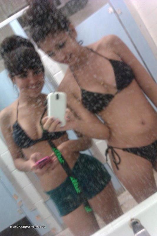 14P Kinky bikini teens camwhoring in a beach resort's bathroom