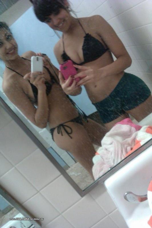 14P Kinky bikini teens camwhoring in a beach resort's bathroom