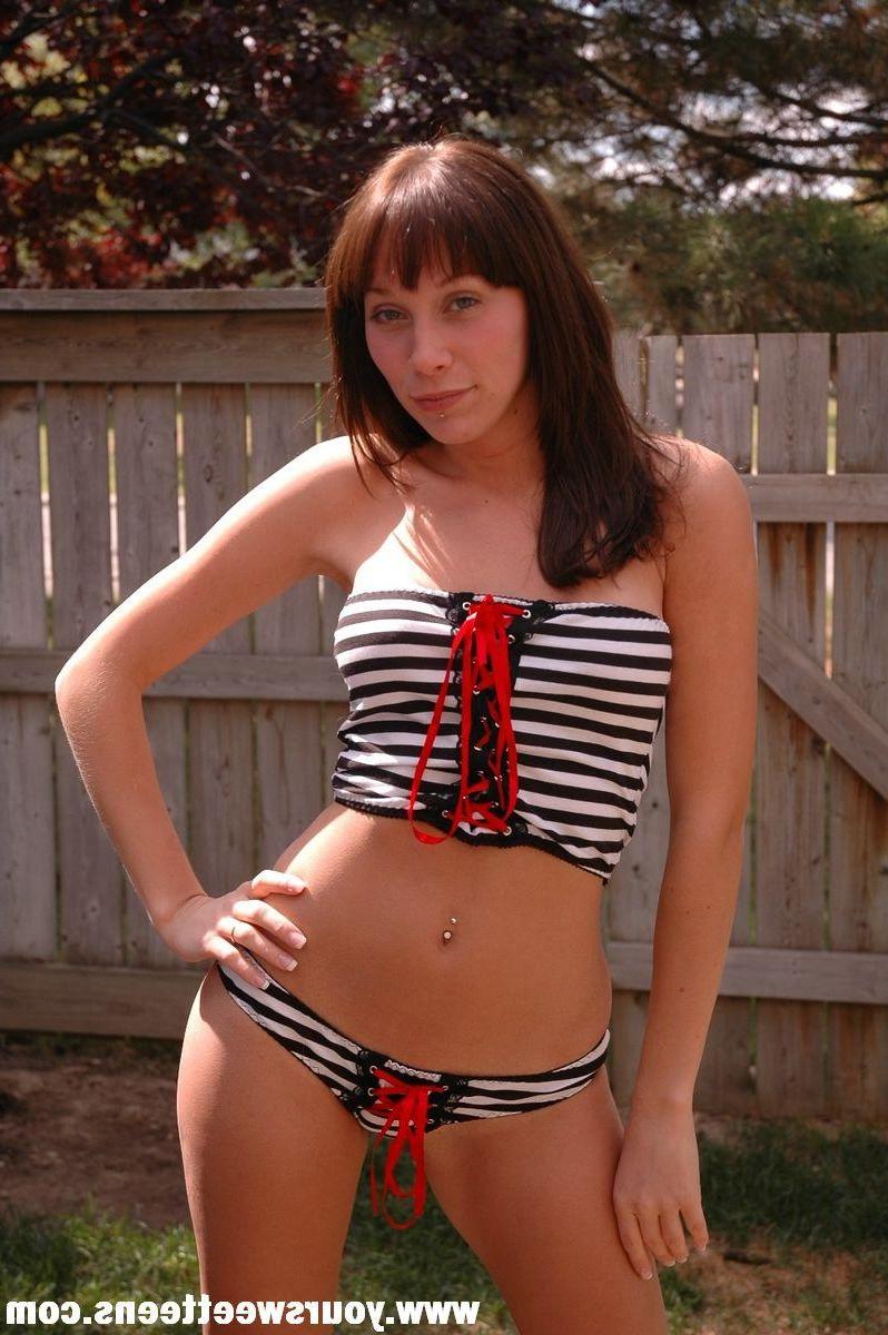15P Pictures of a brunette teen model getting naked outside