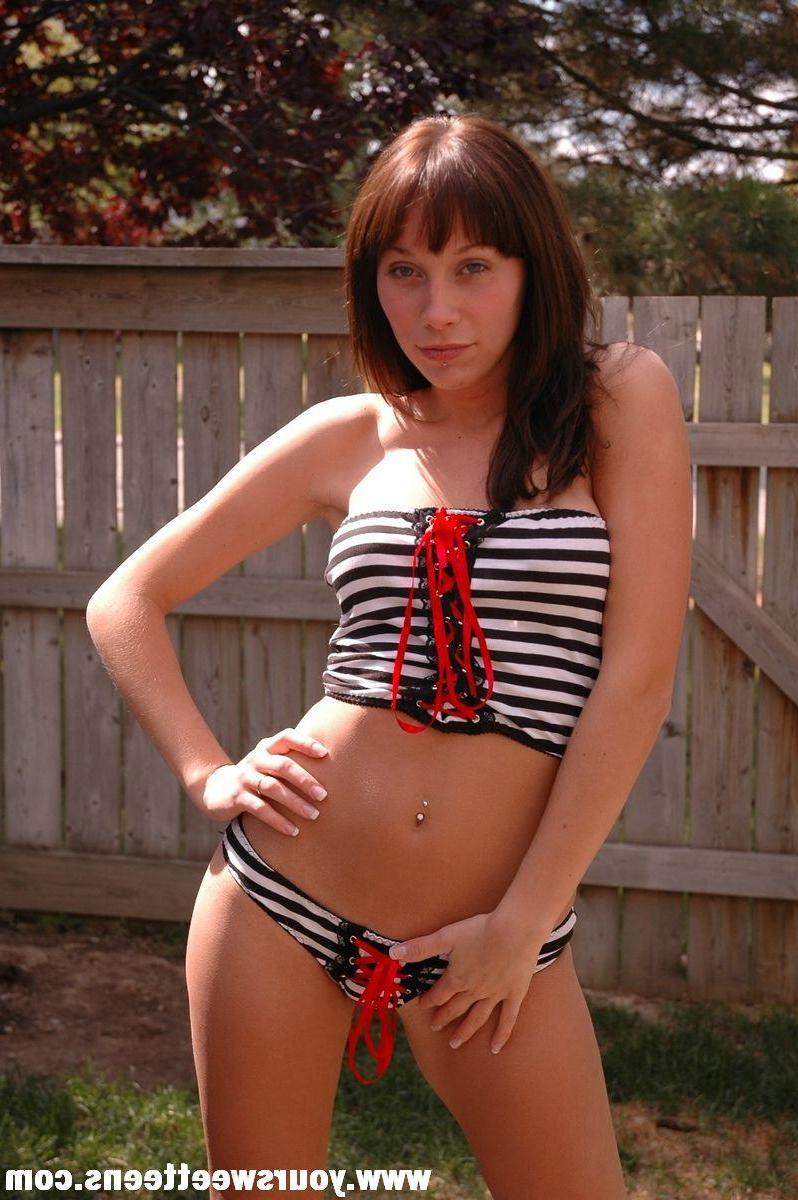 15P Pictures of a brunette teen model getting naked outside