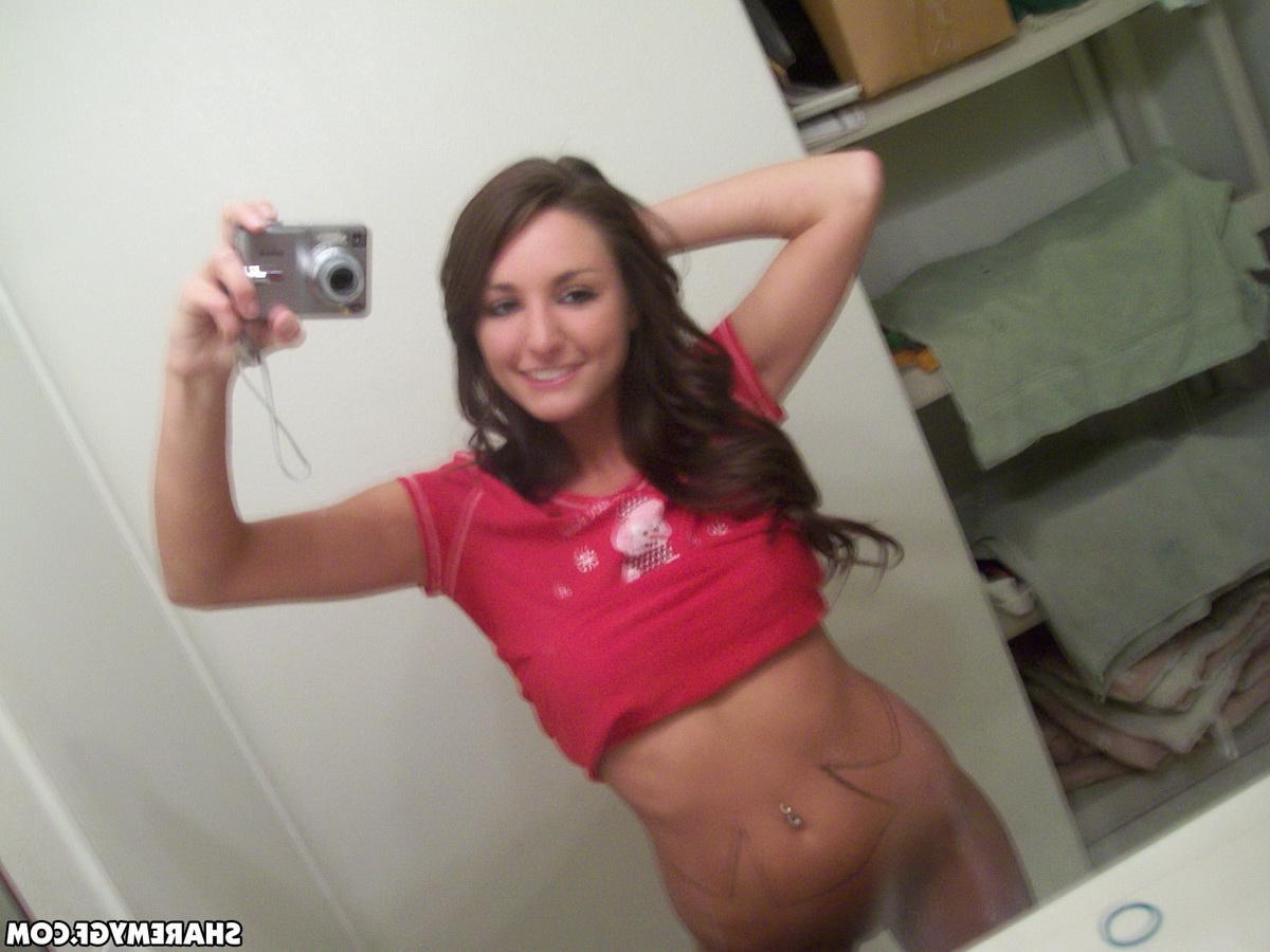 20P A hot brunette teen exposes her tight body and takes saucy pics in the mirror