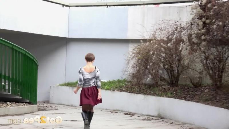 15P Short haired girl pisses in the middle of a path