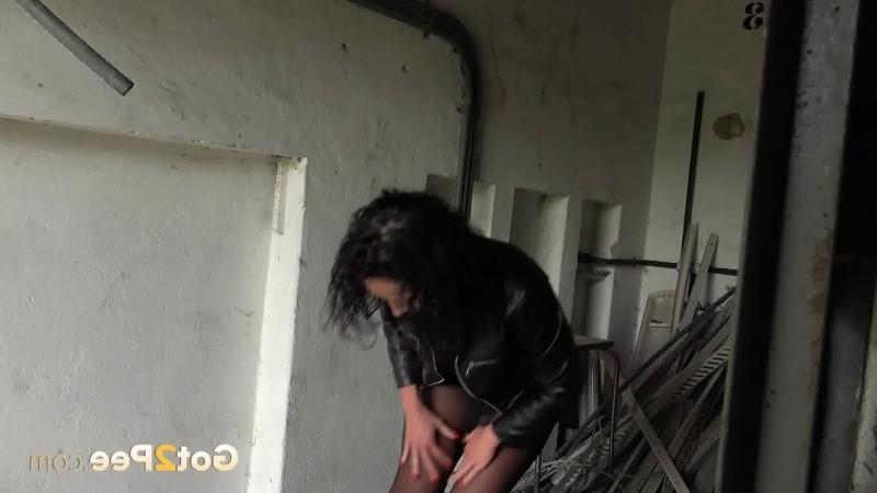 15P Dark haired girl pisses in an abandoned building