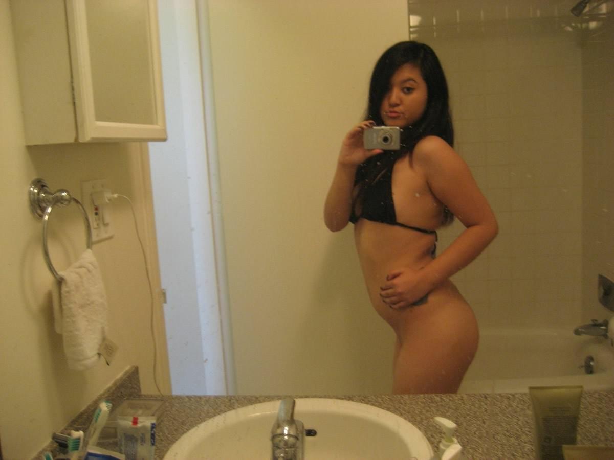 15P Cute girlfriend takes cell phone pics of herself in the bathroom