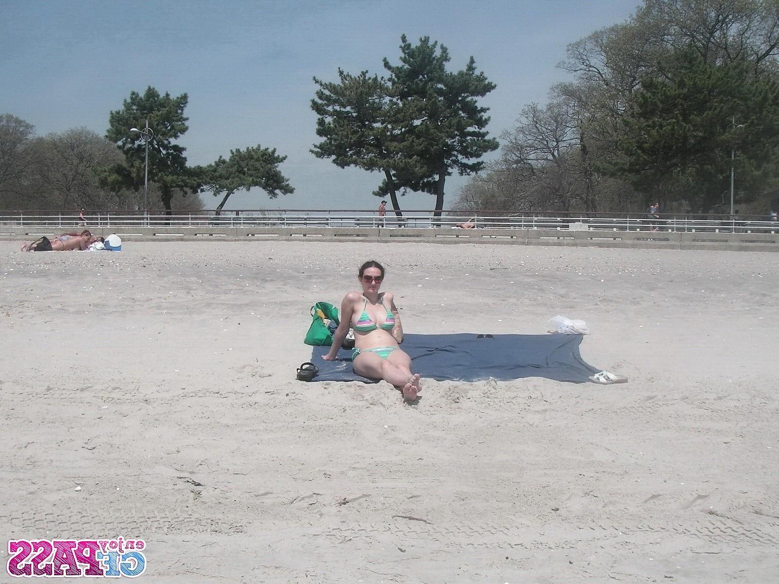 10P Busty brunette takes sunbath on public beach