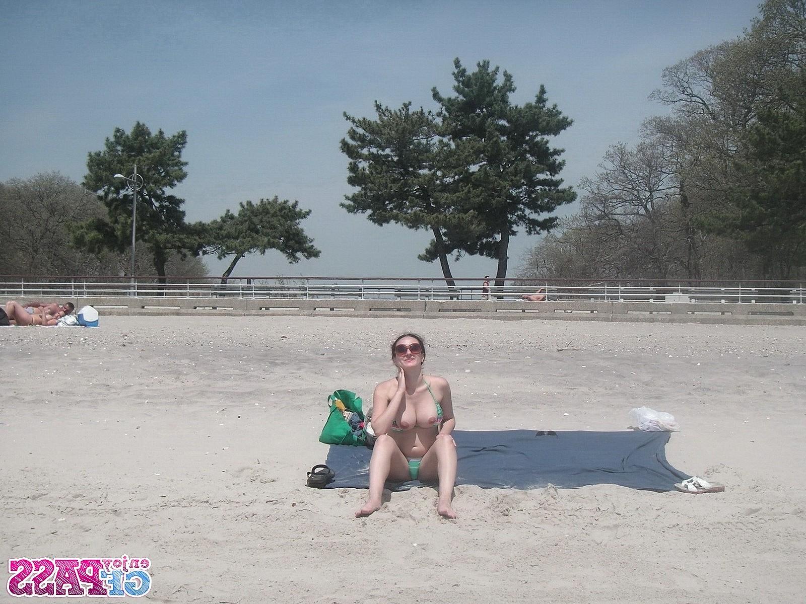 10P Busty brunette takes sunbath on public beach