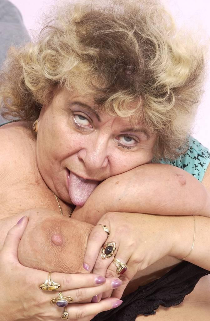 15P fat granny playing with her huge tits