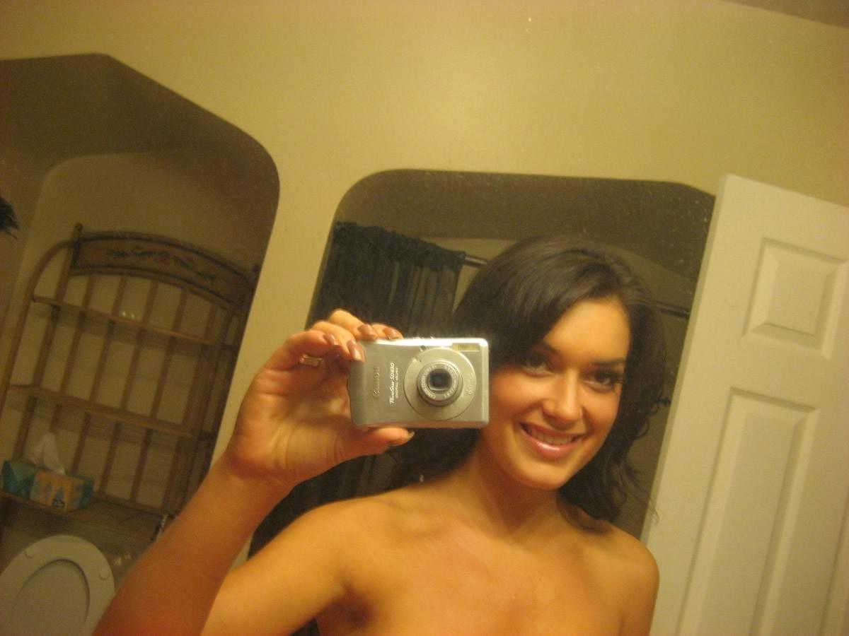 15P Cute girlfriend takes cell phone pics of herself in the bathroom
