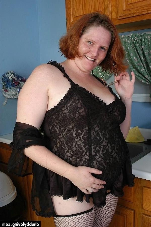 16P Fat redhead Adrienne Plump teasing in the kitchen