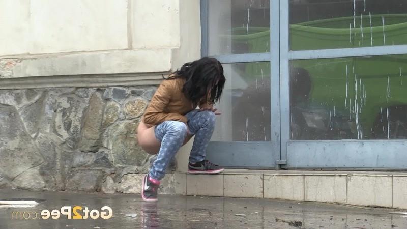 15P Gorgeous dark haired girl pees in public