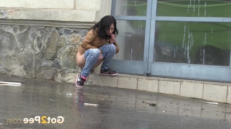 15P Gorgeous dark haired girl pees in public
